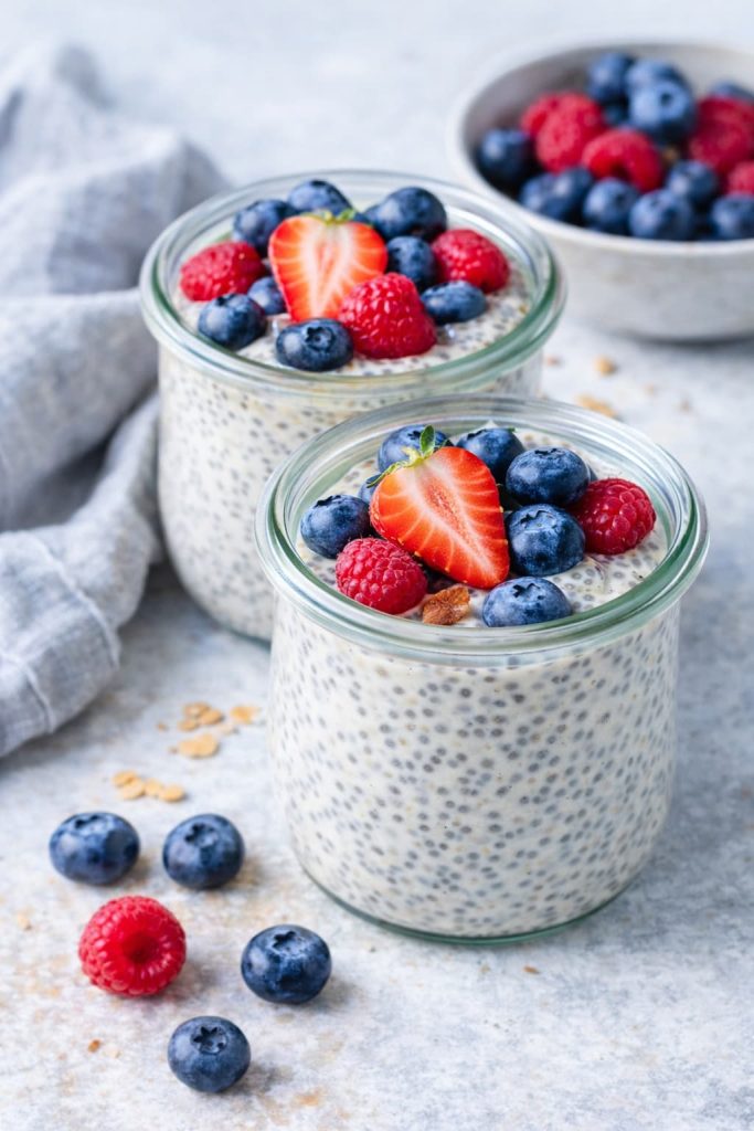 Easy chia pudding with berries in glass jars, healthy diabetes-friendly breakfast with blueberries, strawberries, and raspberries